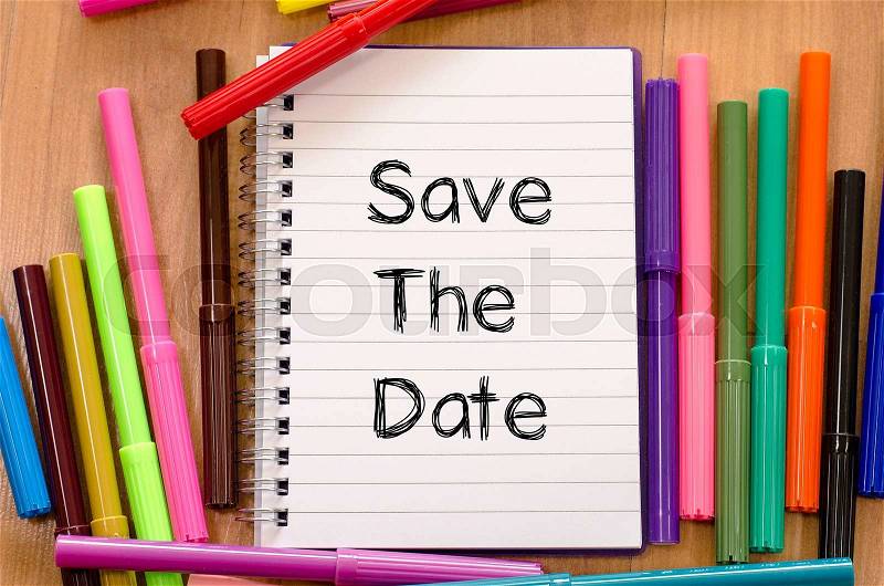 Save the date text concept and colored pens, stock photo