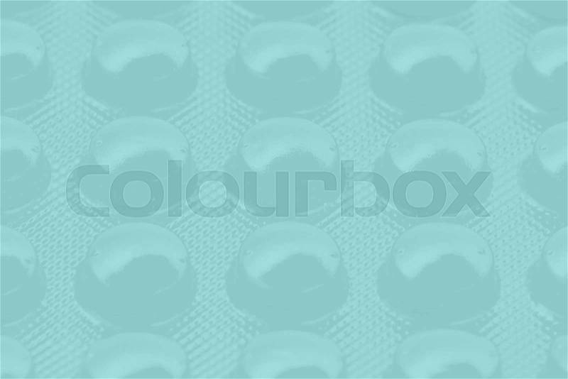 Blue pills in blister pack can be used as background, stock photo