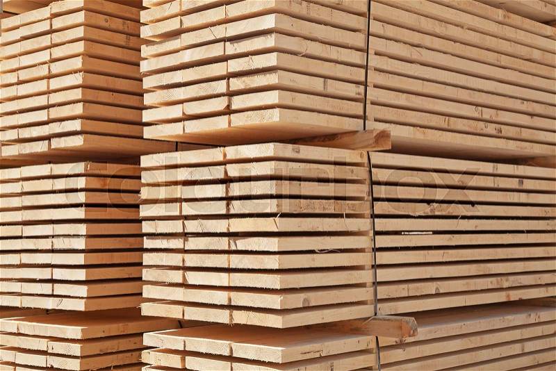 Stack of new wooden studs at the lumber yard, stock photo