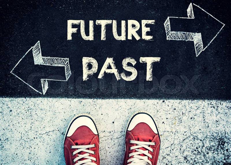 Student standing above the future and past sign,dilemma concept , stock photo