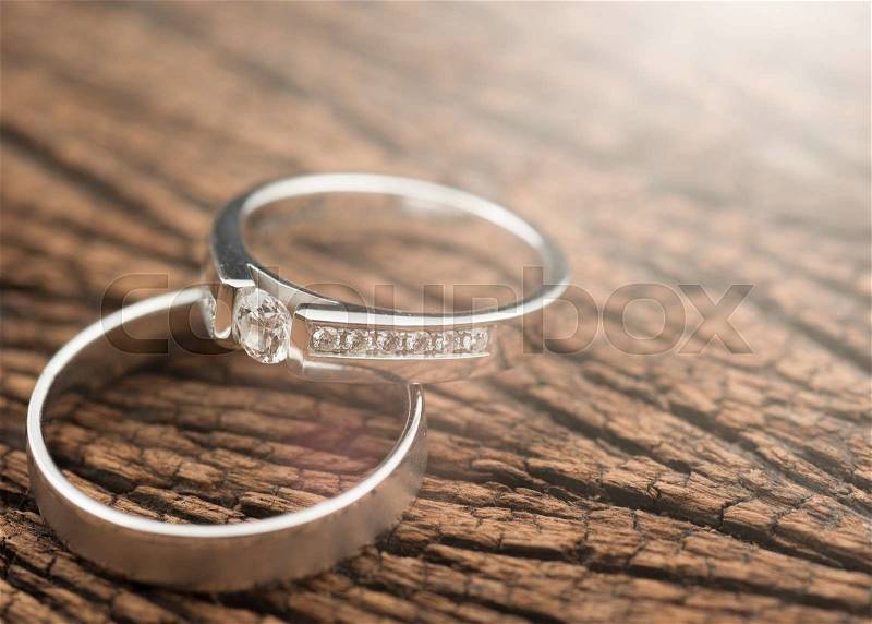 Wedding rings on wood,Light Effect, stock photo