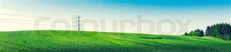 Panorama landscape with pylons and green trees in the spring, stock photo
