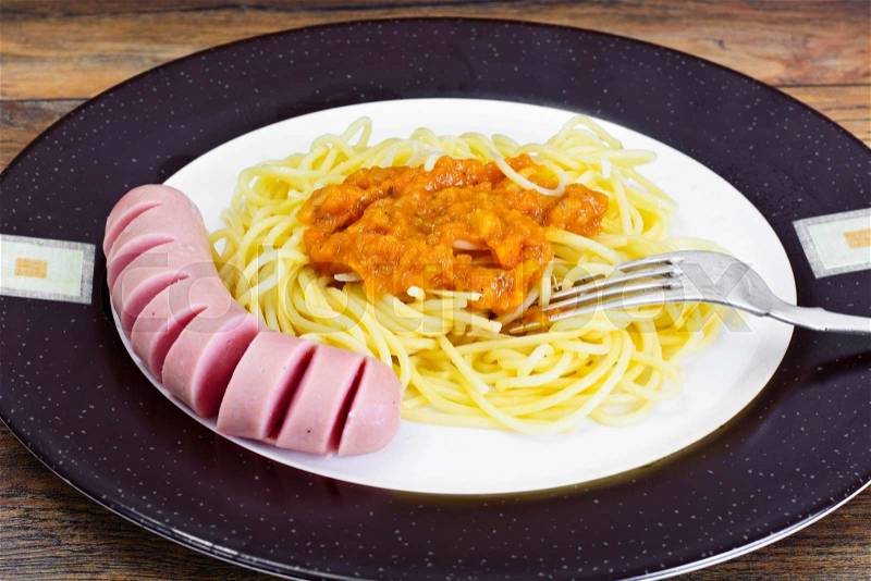 Pasta with Sausage and Squash Caviar on Plate. Studio Photo, stock photo