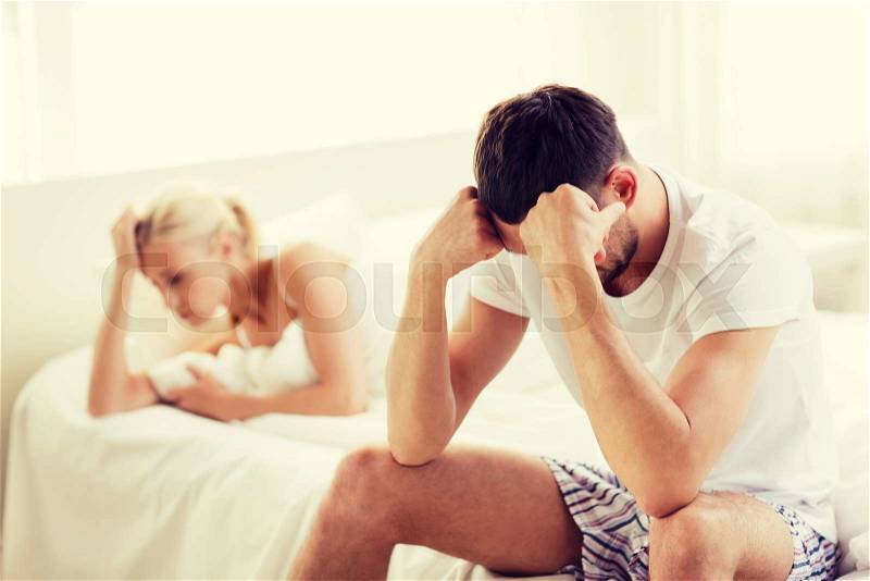 People, relationship difficulties, conflict and family concept - unhappy couple having problems at bedroom, stock photo