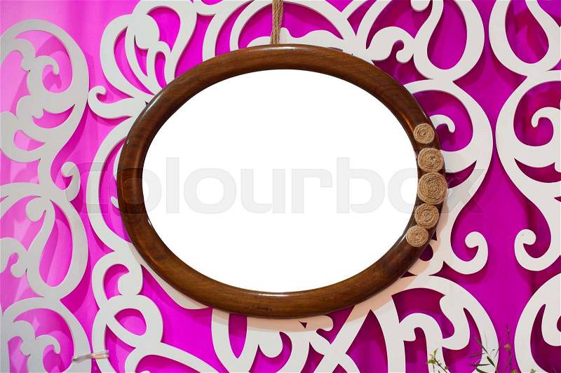 Round of portrait frame isolated vintage hanging on the wall, stock photo
