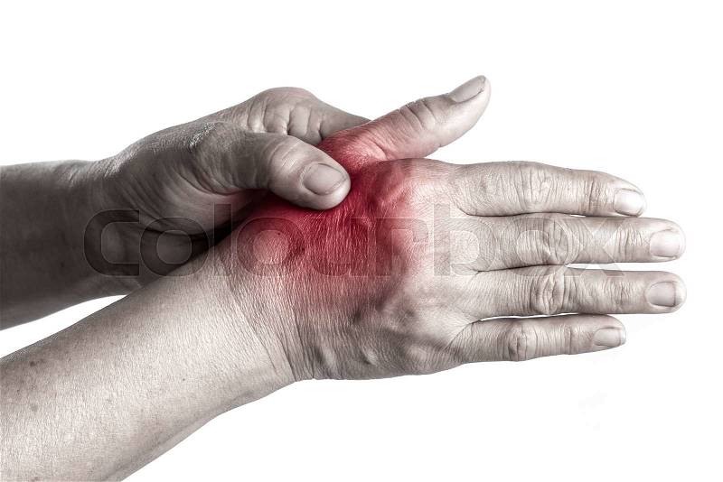 Senior woman touching her injured hand on white background,suffering pain concept, stock photo