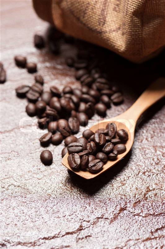 Coffee beans on a stone background, stock photo