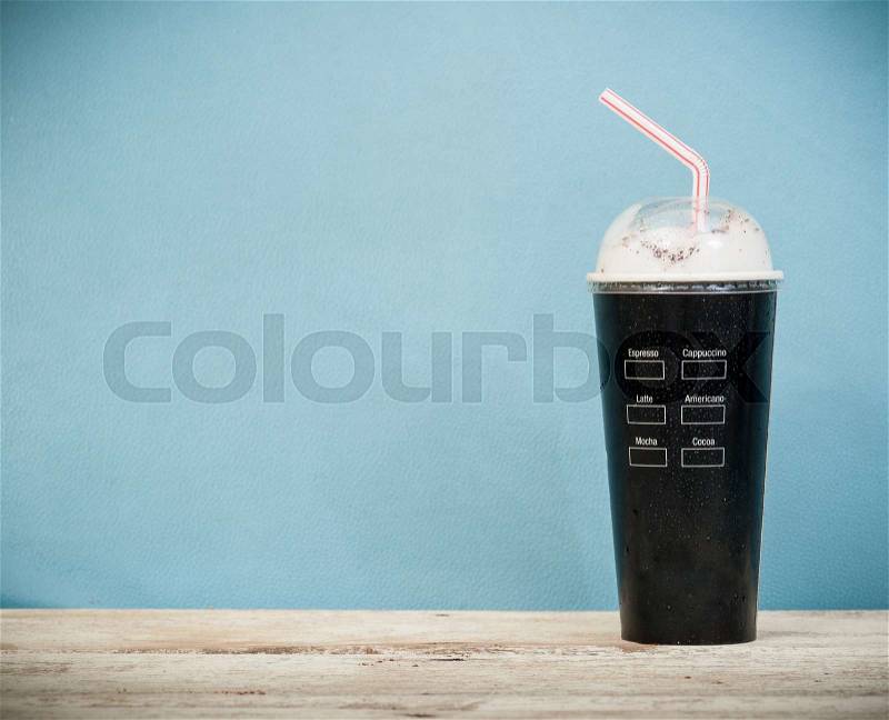 Iced coffee vintage background,Selective focus on paper cup, stock photo