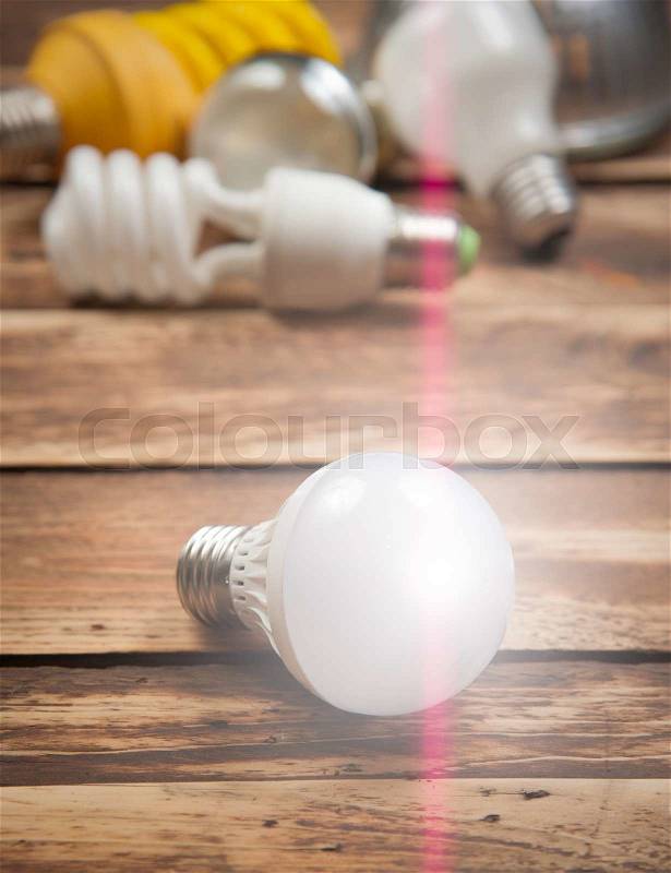 LED bulb and Incandescent bulbs on the wooden,Light Effect, stock photo