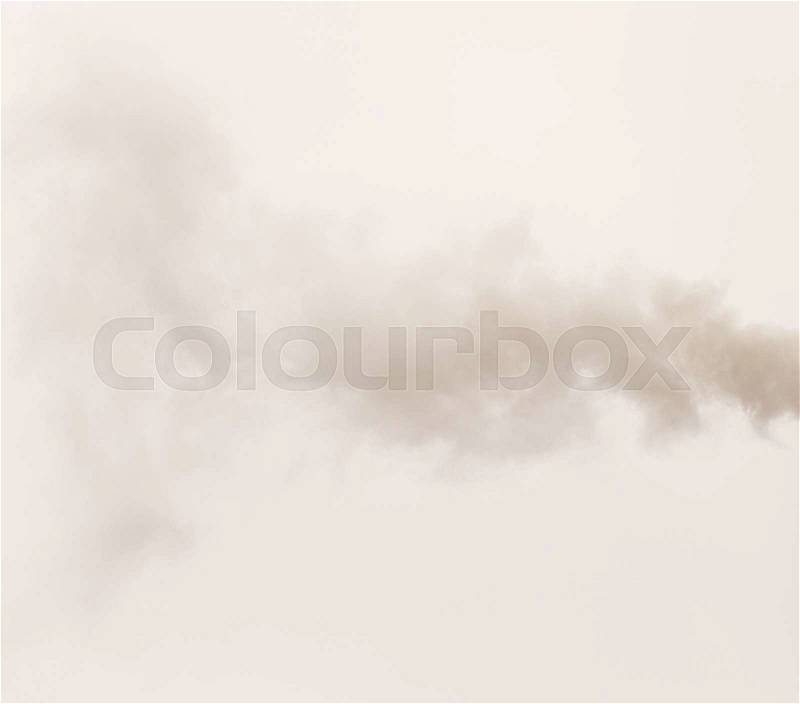 Smoke from a pipe on a cloudy sky, stock photo