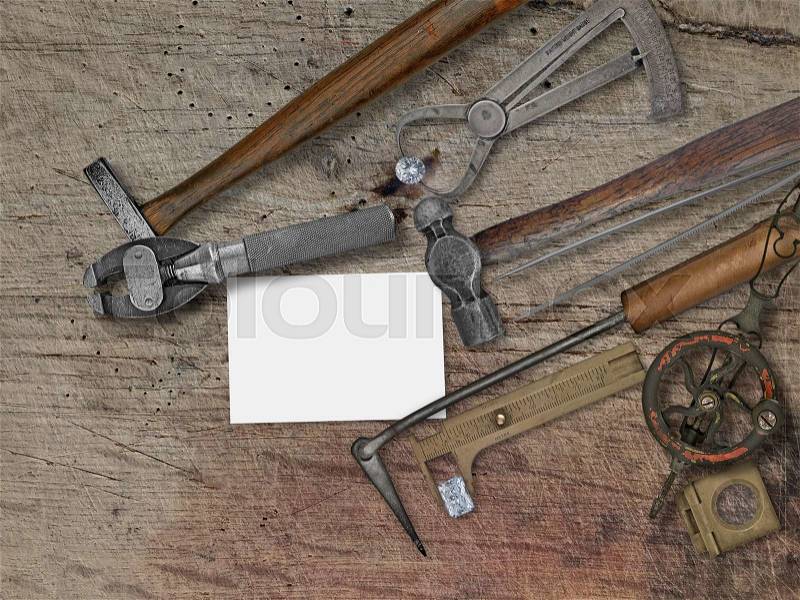 vintage jeweler tools and diamonds over wooden bench, space for your business name, stock photo