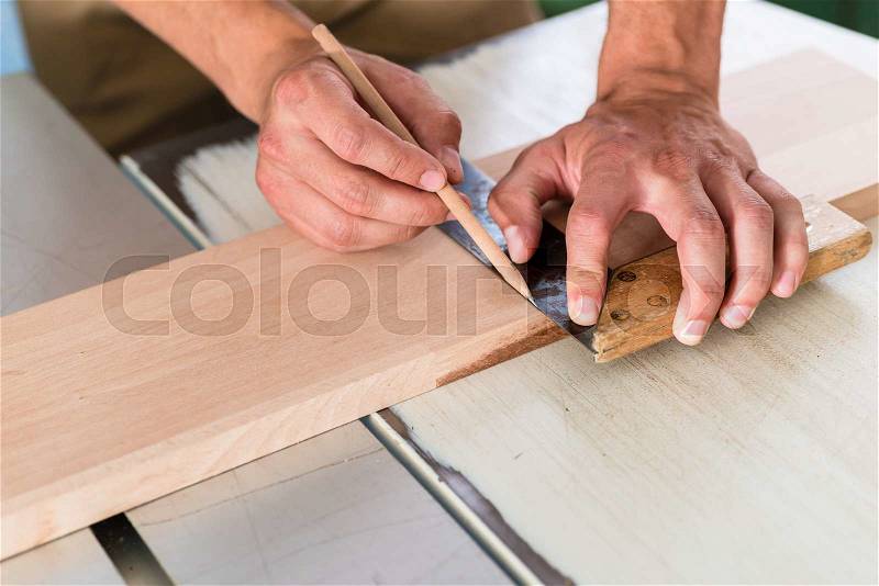 Cabinet maker marking board for cutting, stock photo