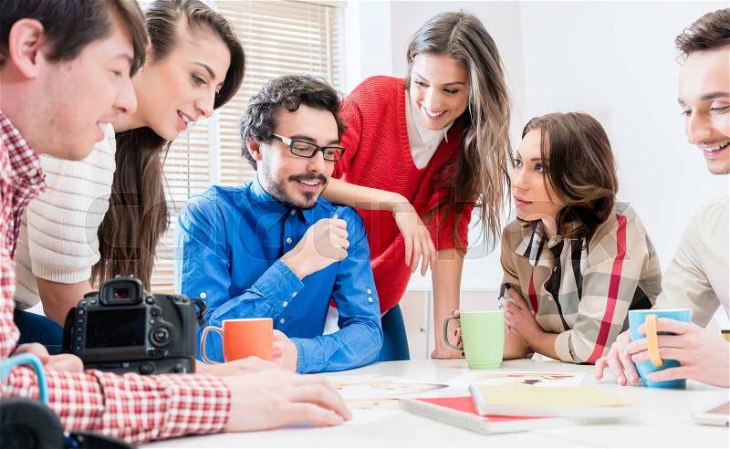 Team in creative agency discussing in meeting having idea brainstorm, stock photo