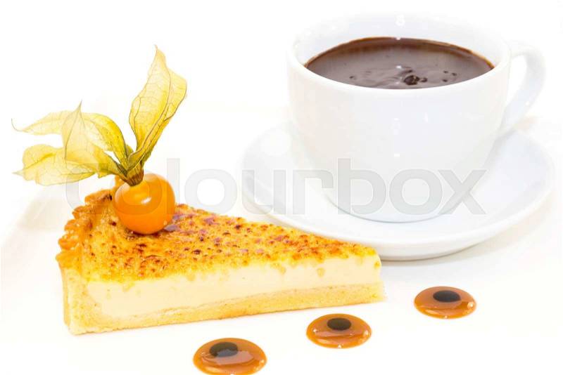 Piece of cake with passion fruit and a cup of hot chocolate, stock photo