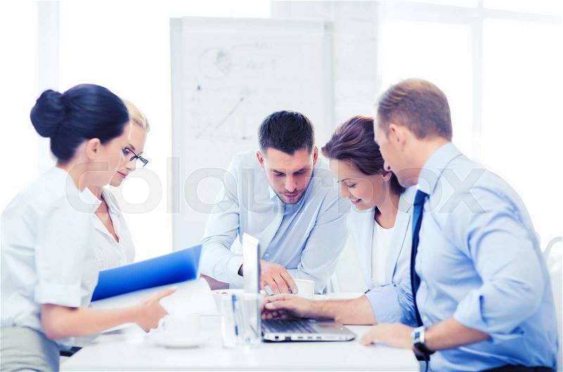 Business concept - business team having meeting in office, stock photo