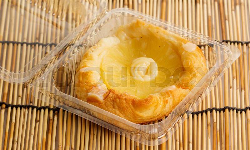 Pineapple Danish Pastry in the plastic box, stock photo
