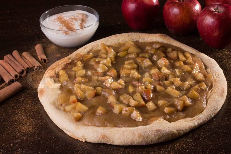 Sweet apple pizza with cinnamon and sugar, stock photo