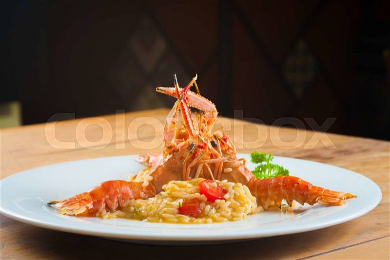 Fresh Gourmet Lagostines with sea food risotto, stock photo