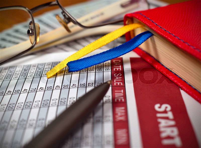 Start up report, glasses, dollars and pen on table, close up, stock photo