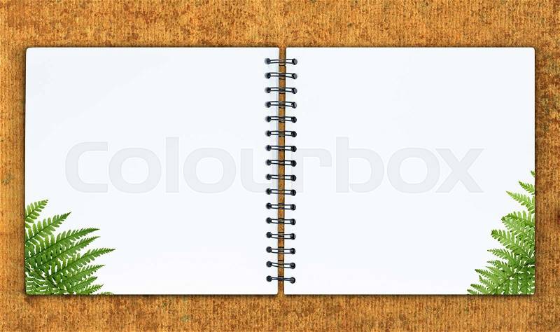 The notebook is on the recycle paper background, stock photo