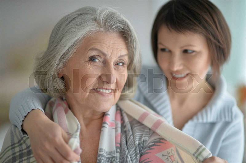 Cheerful senior mother and adult daughter together, stock photo
