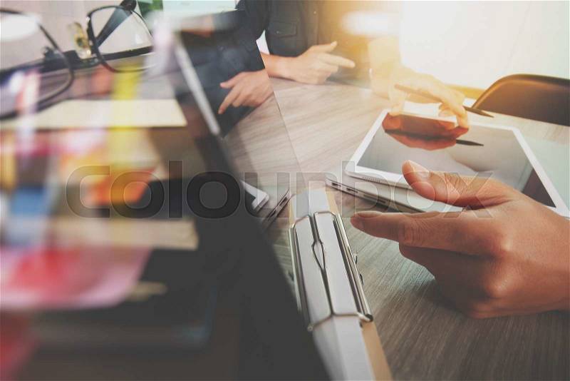 Businessman making presentation with his colleagues and business tablet digital computer at the office as concept, stock photo