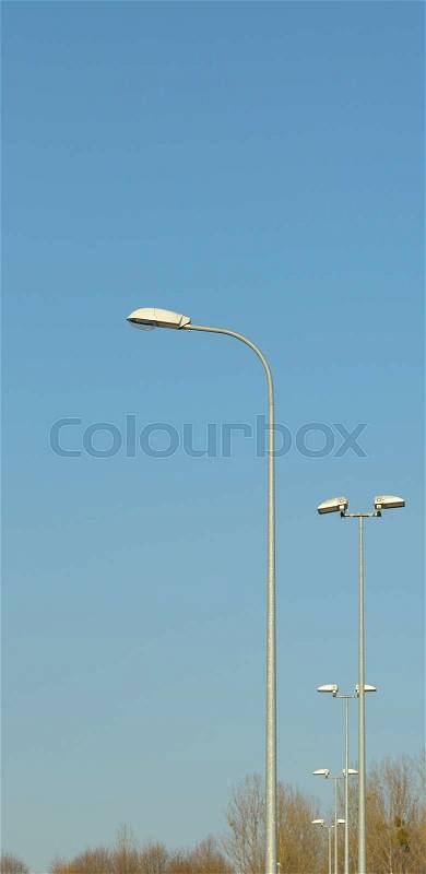 Lamp street lighting on the background of blue sky, stock photo