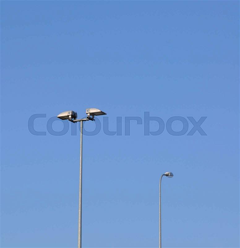 Lamp street lighting on the background of blue sky, stock photo