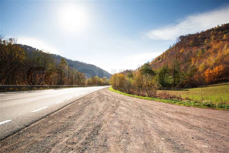 Fall road between the mountains in Carpathians, stock photo