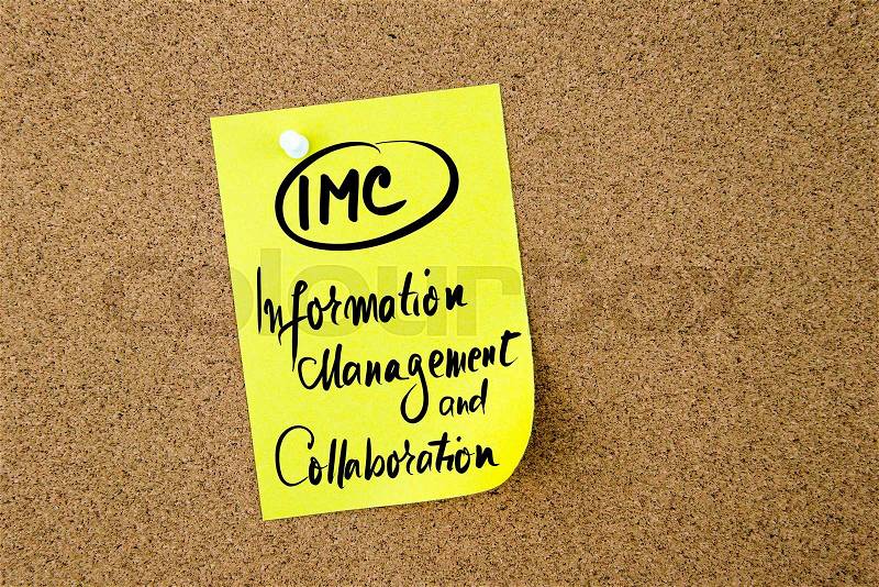 Business Acronym IMC Information Management and Collaboration written on yellow paper note pinned on cork board with white thumbtack, copy space available, stock photo