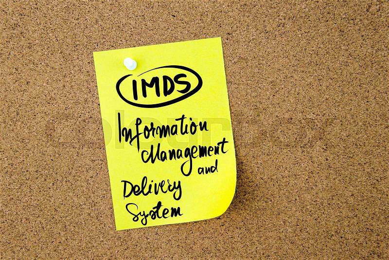 Business Acronym IMDS Information Management and Delivery System written on yellow paper note pinned on cork board with white thumbtack, copy space available, stock photo