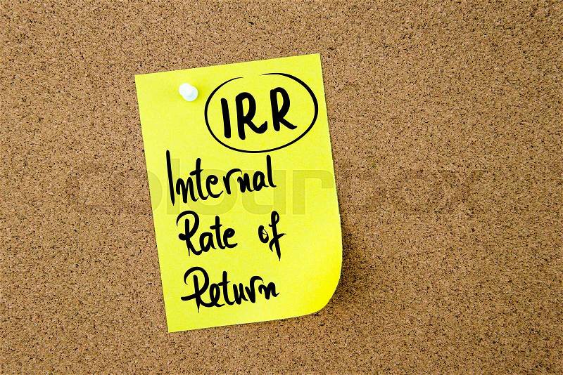 Business Acronym IRR Internal Rate Of Return written on yellow paper note pinned on cork board with white thumbtack, copy space available, stock photo
