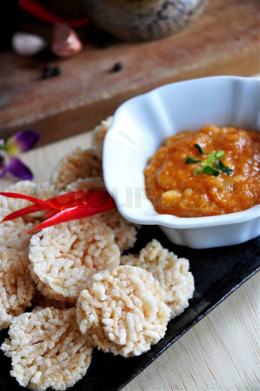 Above of Thai food rice cracker dish with spicy dip sauce, stock photo