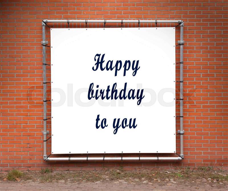 Large banner with inspirational quote on a brick wall - Happy birthday to you, stock photo