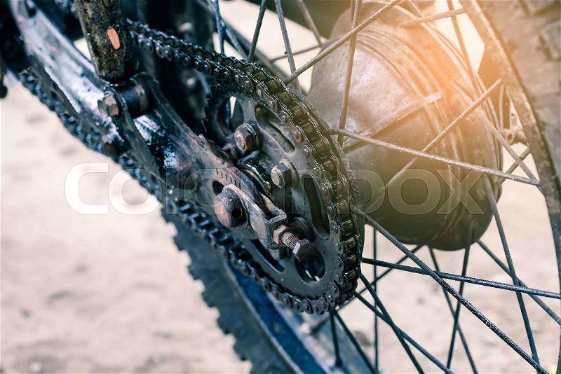Old dirty motorcycle chain on wheel. , stock photo