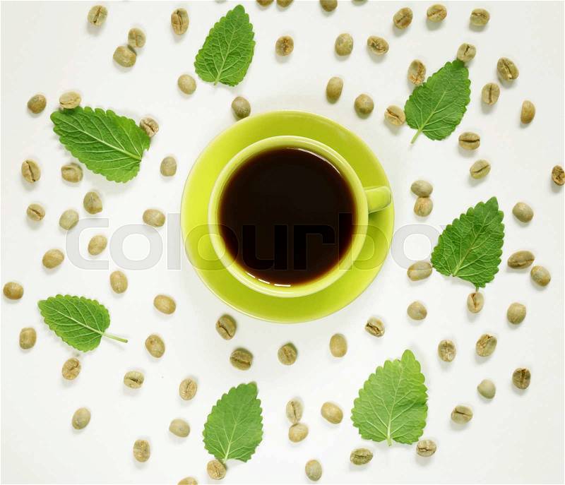 Coffee pattern green coffee beans and mint leaves, stock photo
