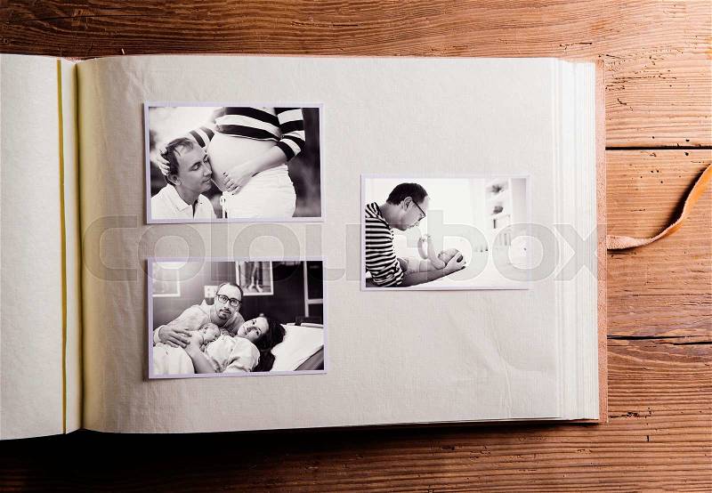 Fathers day composition. Photo album, black-and-white pictures. Studio shot on wooden background, stock photo
