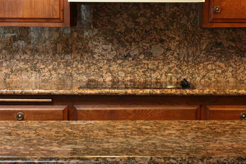 Granite covering for a working surface and an electric plate, a kitchen table, stock photo