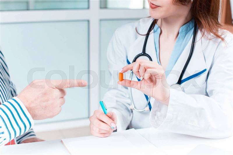 The patient and his doctor in medical office. Healthcare concept, stock photo