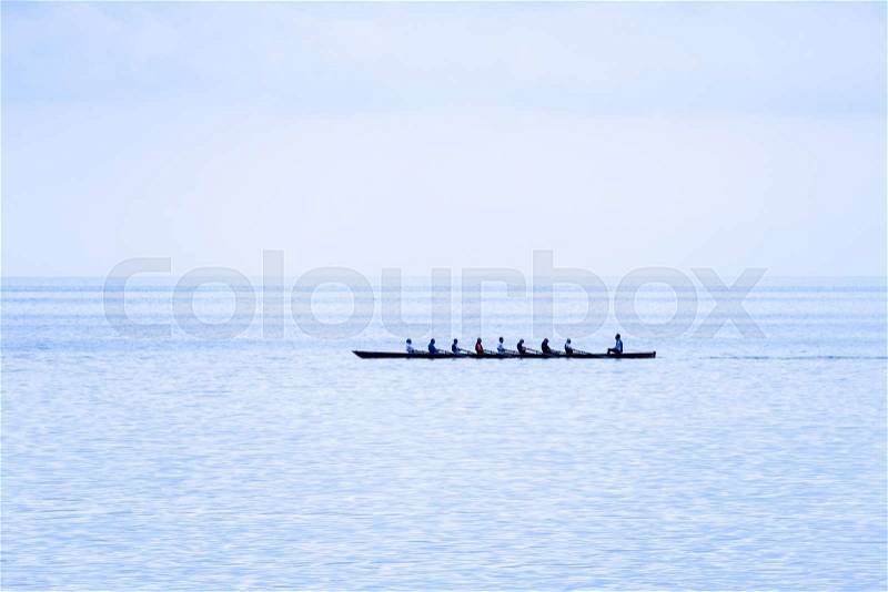 Rowing boat with coxswain. success through team spirit and motiv, stock photo
