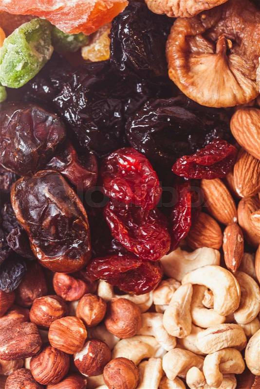 Dry fruits and nuts background - close up healthy sweets, stock photo