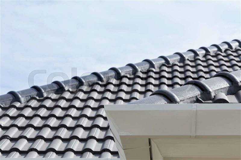 White gutter on the roof top of house, stock photo