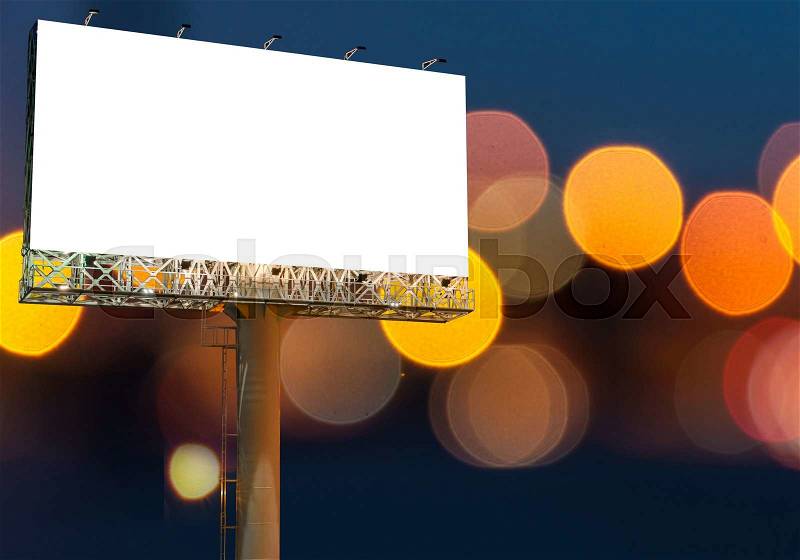 Blank billboard for advertisement on night time with bokeh background, stock photo