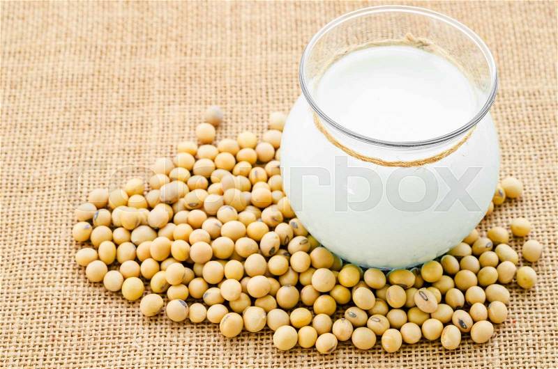Soy milk and soy bean on sack background, stock photo