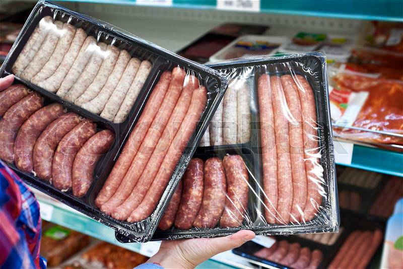 Raw sausage in store for barbecue, stock photo