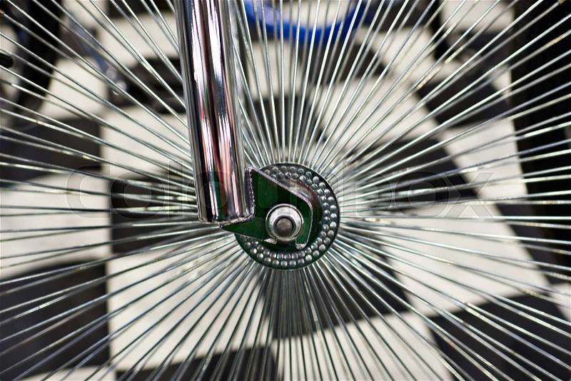 Custom wheel with spokes for vintage bicycle in store, stock photo