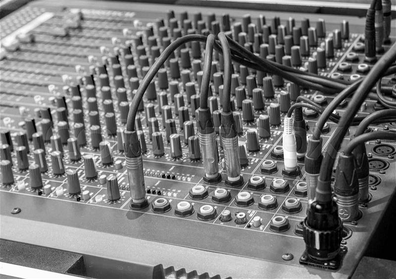 Black and white studio radio mixing. Audio music mixer. Digital sound equipment. Professional equalizer for concert mix, volume control, electronic instrument. Broadcast switch. Record technology, stock photo