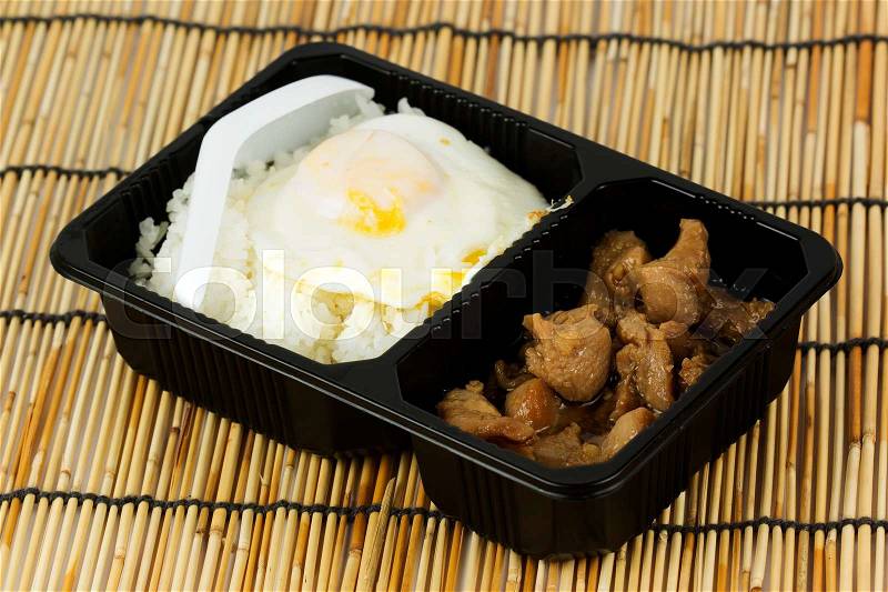 Chicken fried garlic with rice in Plastic package, stock photo