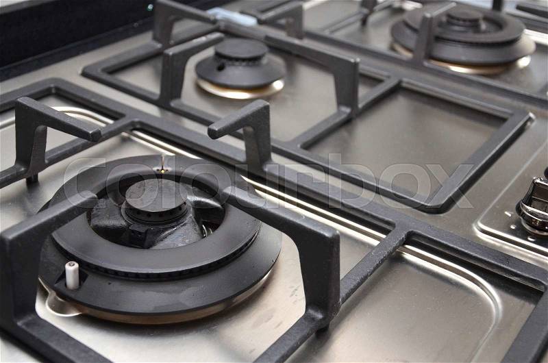 Kitchen gas stove in the kitchen. Upper part of gas cooking range, stock photo