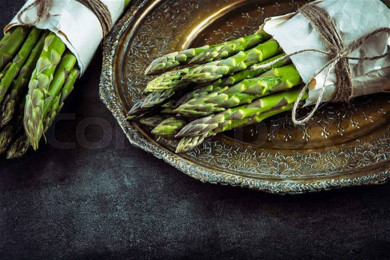 Asparagus. Raw asparagus. Fresh Asparagus.Green Asparagus. Tied asparagus in other positions, stock photo